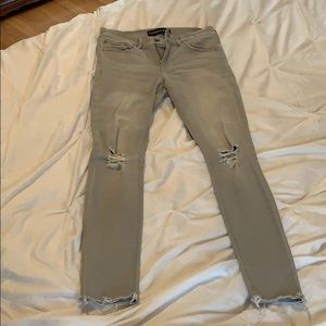 Light gray destroyed 6 long Express jeans